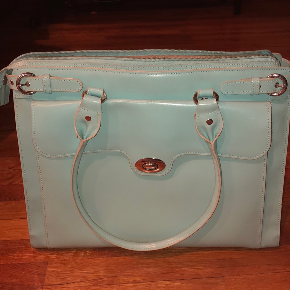 Woman’s light blue briefcase